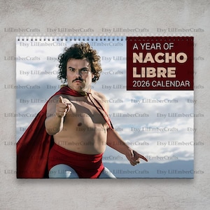 May include: A 2026 calendar featuring a comedic image of a man in a red cape and briefs, pointing at the viewer. The calendar's title reads "A Year of Nacho Libre 2026 Calendar" in a maroon box. The calendar is spiral-bound.