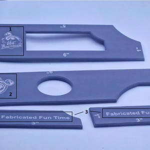 May include: Gray, geometric-shaped tools with the text "Fabricated Fun Time" and the logo "206 Penetration". The tools have measurements in inches, including a 6-inch ruler and a 3-inch piece.