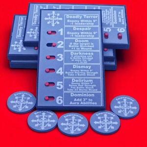 May include: Blue game cards with white text and red switches, and blue circular tokens, set against a red background. The cards feature text like "Deadly Terror" and "Dominion." The tokens are marked "Empowered" with a symbol.