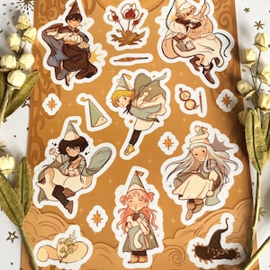 May include: A rectangular sticker sheet featuring Witch Hat Atelier characters and motifs in a warm orange color palette. The sheet includes various illustrations of figures in pointed hats, magical items, and small creatures, with the text witch hat atelier.