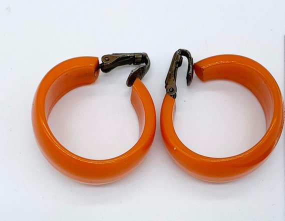 Vintage 1950’s wide Orange Bakelite earrings chunk