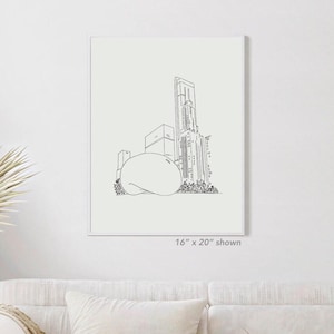 Op de afbeelding: Zwart-wit lijntekening van een stadsgezicht met een boonvormige sculptuur voor wolkenkrabbers. De print is in een witte lijst. De tekst "16" x 20" shown" is zichtbaar. Afmetingen: ongeveer 40,6 x 50,8 cm.