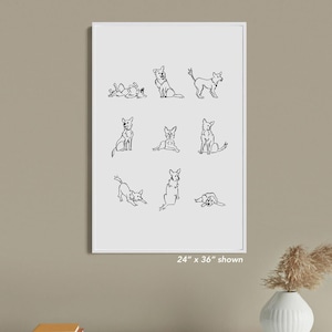 May include: A framed print with nine minimalist line drawings of dogs in different poses. The artwork is in black against a white background. The print size is 61cm x 91cm as shown.