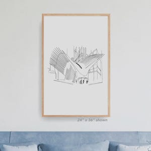 May include: A framed architectural sketch print. The black and white line drawing depicts a modern building with a curved roof and geometric lines. The frame is a light wood color. The text "24" x 36" shown" is at the bottom.
