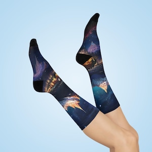 May include: A pair of black knee-high socks with a colourful galaxy print featuring a cityscape and stars.