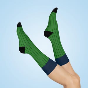 May include: A pair of green and navy blue striped knee-high socks with black trim.