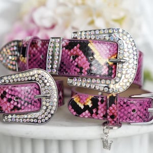 May include: A rustic wooden sign with the text "Welcome to our home" in white lettering. The sign features a distressed finish and a simple, inviting design, perfect for a front porch or entryway.