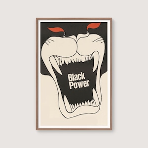 May include: A framed art print featuring a stylized illustration of a roaring panther's face. The artwork is primarily black and white, with red accents. The words "Black Power" are prominently displayed within the panther's open mouth.