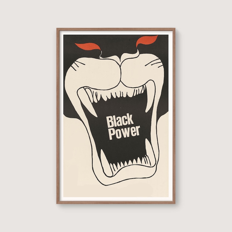 May include: A framed art print featuring a stylized illustration of a roaring panther's face. The artwork is primarily black and white, with red accents. The words "Black Power" are prominently displayed within the panther's open mouth.