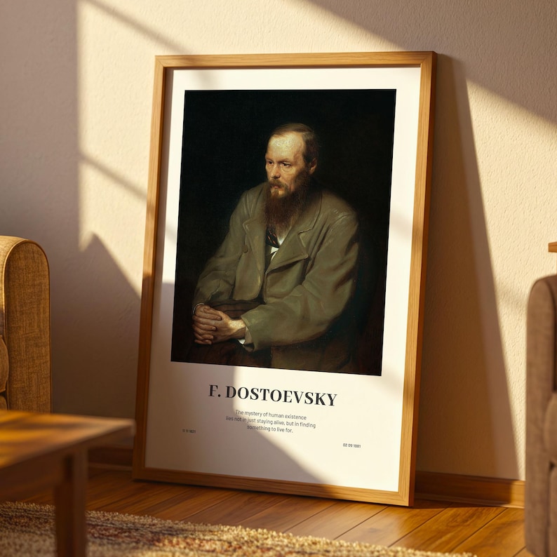 May include: A framed print featuring a portrait of F. Dostoevsky. The artwork depicts a man with a long beard and a serious expression, wearing a coat. The print is in a wooden frame and includes the author's name and a quote.