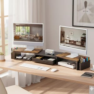 May include: A wooden desk with two computer monitors, each resting on a monitor stand. The stands have storage compartments and are filled with office supplies. A keyboard, mouse, and other accessories are on the desk.