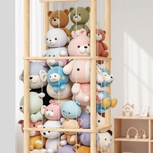 May include: A wooden storage unit filled with various plush animal toys. The unit has multiple shelves and is labeled "OUR ZOO". The plush toys are in various colors, including pink, blue, brown, and white.