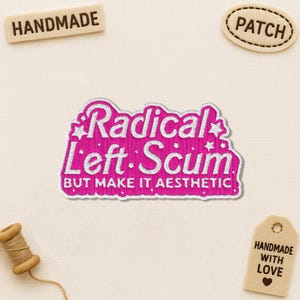 May include: A pink embroidered patch with the words "Radical Left Scum" in white, with the phrase "But Make It Aesthetic" below. The image also includes a "Handmade" tag and a "Patch" tag.