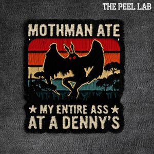 May include: Embroidered patch with a black Mothman design and red eyes, set against a sunset backdrop. The text reads "MOTHMAN ATE MY ENTIRE ASS AT A DENNY'S". The Peel Lab logo is in the top right corner.