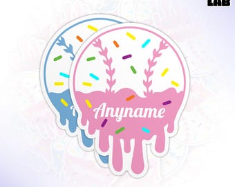 May include: Two die-cut stickers with a baseball theme. One is light blue, the other pink, both with white sprinkles and a dripping design. The word "Anyname" is written in white script. The text "WATERPROOF DIE-CUT STICKERS" is at the top.