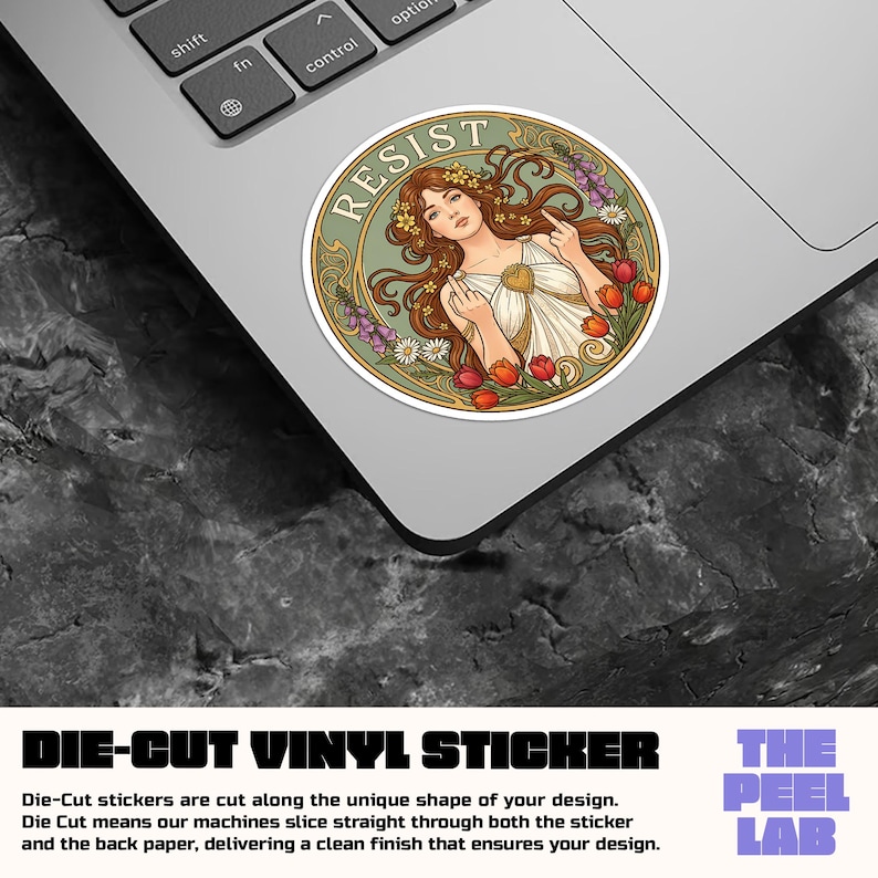 May include: A die-cut vinyl sticker featuring a woman with long brown hair, floral crown, and the word "RESIST". The sticker has a green border with flowers and is on a laptop. The sticker is from The Peel Lab.