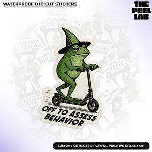 May include: A die-cut sticker featuring a green frog wearing a witch hat and riding a black scooter. The sticker has the text "OFF TO ASSESS BEHAVIOR" and is surrounded by similar stickers. The Peel Lab logo is in the upper right corner.