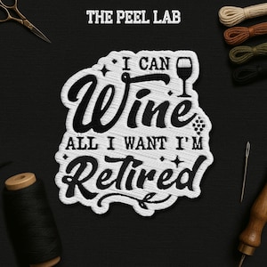 May include: Embroidered patch with the text "I Can Wine All I Want I'm Retired" in black and white. The patch features a wine glass and star accents. The Peel Lab logo is at the top.