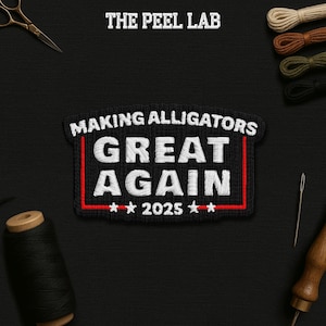 May include: Embroidered patch with the text "MAKING ALLIGATORS GREAT AGAIN" in white thread on a black background. The patch has a red border and the year "2025" with stars. The Peel Lab logo is at the top.