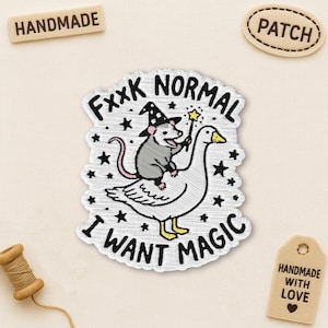 May include: Embroidered patch featuring a possum wearing a witch hat and riding a goose, holding a magic wand. The patch reads "Fxxx Normal, I Want Magic" in black text with star accents. Handmade patch.