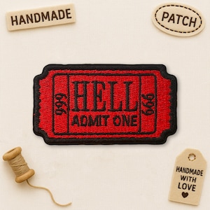 May include: A red and black embroidered patch with the text "HELL ADMIT ONE" and the numbers "666" and "999". The patch is surrounded by other handmade items, including a "PATCH" label and a "HANDMADE" label.
