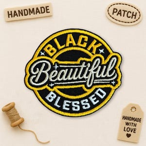 May include: Embroidered patch with the words "BLACK BEAUTIFUL BLESSED" in a circular design with a yellow border. The patch is surrounded by small wooden tags that say "HANDMADE", "PATCH", and "HANDMADE WITH LOVE".