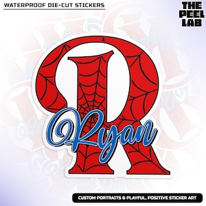 May include: A die-cut sticker featuring a large red letter "R" with a spiderweb design. The name "Ryan" is written in blue script across the letter. The sticker has a white border and the text "WATERPROOF DIE-CUT STICKERS".