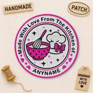 May include: Embroidered patch with a pink bowl, whisk, chef's hat, and bow. The text reads "Made With Love From The Kitchen of" and "ANYNAME". Includes wooden tags that say "HANDMADE" and "PATCH".