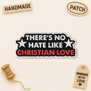 May include: Embroidered patch with the text "THERE'S NO HATE LIKE CHRISTIAN LOVE" in white and red on a black background, with white stars on each side. Additional tags read "HANDMADE", "PATCH", and "HANDMADE WITH LOVE".