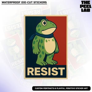 May include: A die-cut sticker featuring a cartoon frog with green skin and a blue scarf, standing in front of a red and navy blue background. The word "RESIST" is printed in bold letters at the bottom. The text "WATERPROOF DIE-CUT STICKERS" is at the top.