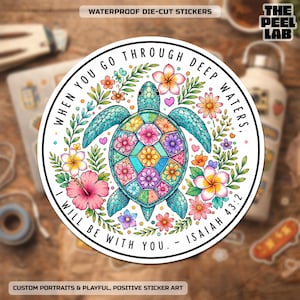 May include: A circular waterproof die-cut sticker featuring a sea turtle with a colorful floral shell pattern surrounded by tropical flowers and greenery. The text reads: WHEN YOU GO THROUGH DEEP WATERS, I WILL BE WITH YOU. - ISAIAH 43:2.