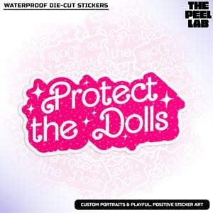 May include: Pink and white waterproof sticker with the text "Protect the Dolls" in a sparkly font. The sticker is die-cut and has a rounded shape.