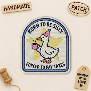 May include: Embroidered patch with a cartoon goose wearing a party hat and holding a mug. The patch reads "BORN TO BE SILLY" and "FORCED TO PAY TAXES" with a star background. Includes "HANDMADE" and "PATCH" tags.