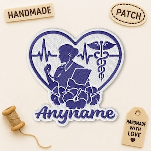 May include: Embroidered patch in a heart shape, featuring a nurse silhouette, a medical symbol, and floral accents. The patch is blue and white, with the word "Anyname" in script. Includes "HANDMADE" and "PATCH" tags.