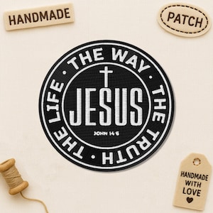 May include: A black and white embroidered patch with the word "JESUS" in the center, surrounded by "THE WAY, THE TRUTH, THE LIFE." Includes the text "JOHN 14:6." Additional tags read "HANDMADE" and "PATCH."