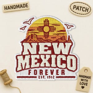 May include: An embroidered patch featuring a yellow sun with a Zia symbol, orange desert landscape, and white text reading NEW MEXICO FOREVER EST. 1912. The patch is surrounded by two small white bird silhouettes on a light beige fabric background.