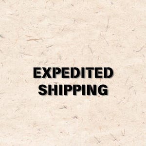 May include: The words "EXPEDITED SHIPPING" are printed in bold black letters on a textured, light beige background. The background has a subtle, organic pattern.