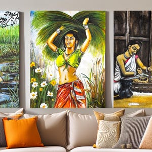 May include: Set of three framed paintings depicting rural Indian life. One shows women working in a field, another a woman carrying foliage, and the third women grinding grain. The paintings are colorful and detailed, with a focus on the figures.