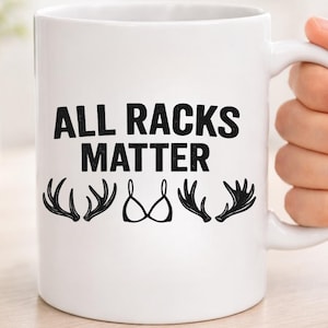 May include: A set of three ceramic mugs with a speckled, matte finish. The mugs are in shades of cream, light gray, and dark gray. Each mug has a simple, minimalist design, perfect for coffee or tea.