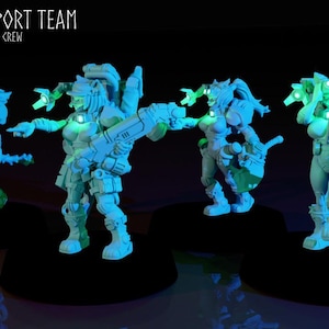 May include: A group of light blue futuristic figurines, possibly for tabletop gaming or display. The figures are in dynamic poses, with glowing green accents on their heads and weapons. The text "SUPPORT TEAM" and "<CREW" is visible.