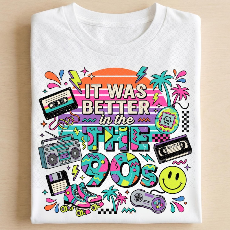 May include: A white t-shirt featuring a colorful graphic print with the text "IT WAS BETTER in the 90s". The design includes a cassette tape, boombox, floppy disk, roller skates, handheld game, smiley face, and video game controller.