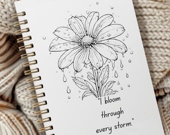 May include: A black and white illustration of a flower with raindrops falling from it. The text "I bloom through every storm." is written below the flower.