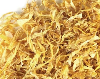 May include: Close-up of dried calendula petals, showcasing a mix of yellow and light brown hues. The petals are delicate and textured, with a natural, organic appearance. Ideal for herbal remedies and skincare.