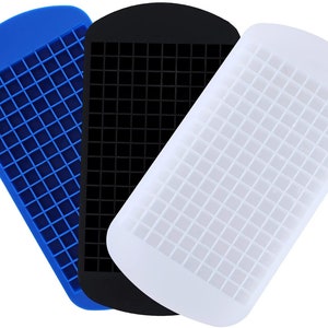 May include: Three silicone ice cube trays, one blue, one black, and one white. Each tray has a grid of small squares for making ice cubes.