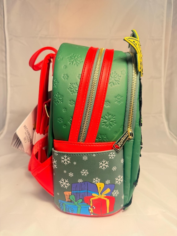 green light up mini backpack Loungefly ELF CLAUSOMETER : Clothing, Shoes & Jewelry Features Faux leather (polyurethane) Sturdy top handle Adjustable shoulder straps Star lights up Applique The Grinch Dr Seuss Loungefly