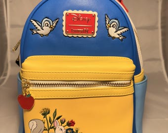 Celebrate 85 years of magic with this enchanting Loungefly Disney Snow White Anniversary Mini Backpack!