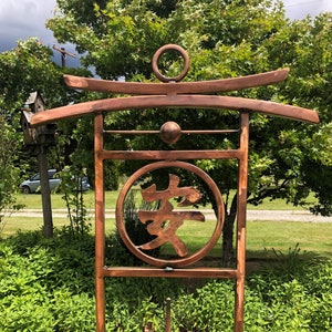 Metal Garden Trellis  with Double Torii Gate Arches and the Japanese Kanji Symbol for "Tranquility"