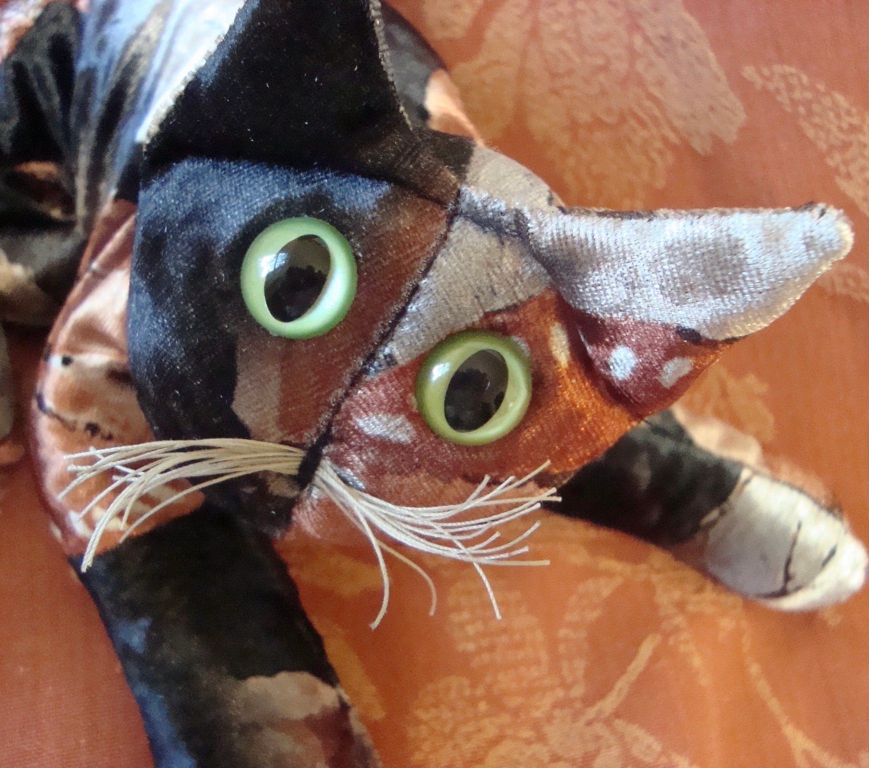 stuffed tortoiseshell cat