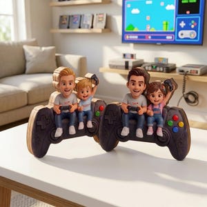 May include: Two wooden decorative figures shaped like game controllers, each featuring a pair of cartoon-style characters. One controller shows a man labeled DAD and a child labeled SCOTT, while the other shows a man labeled DAD and a girl labeled LASSY.