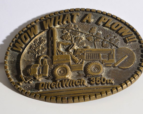 Vintage Ditch Witch 360 Sx 1980s Brass belt buckle, Construction farming Advertising belt buckle Wow what a Plow Dealer Premium Award Design